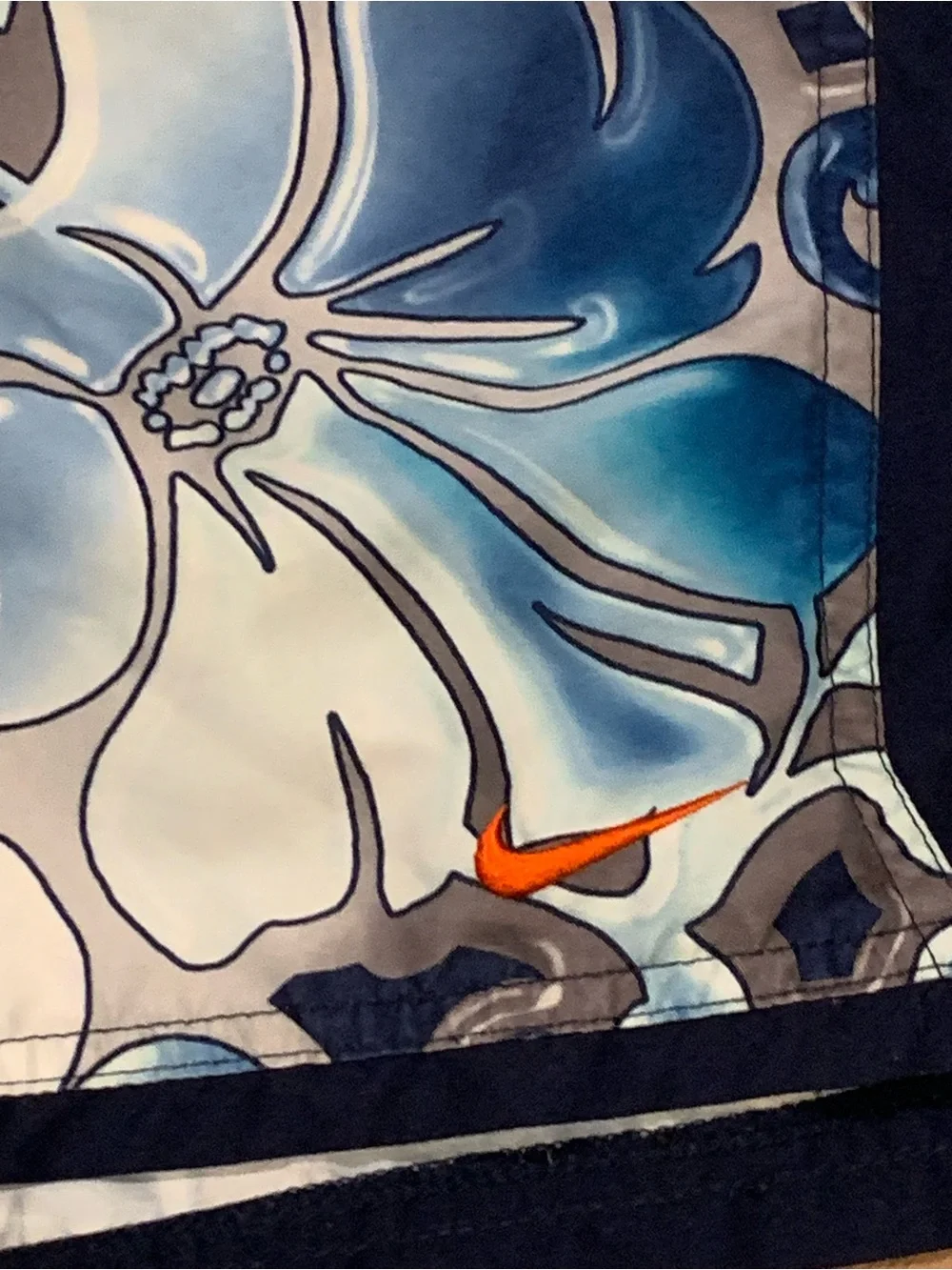 Nike Blue Floral Swim Trunks with Orange Swoosh